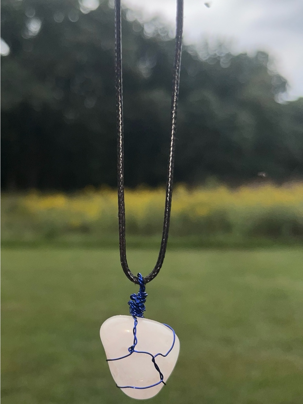 Handcrafted White Quartz Pendant Necklace with Blue Wire